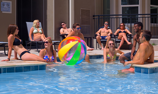Group of residents gathered in resort style swimming pool
