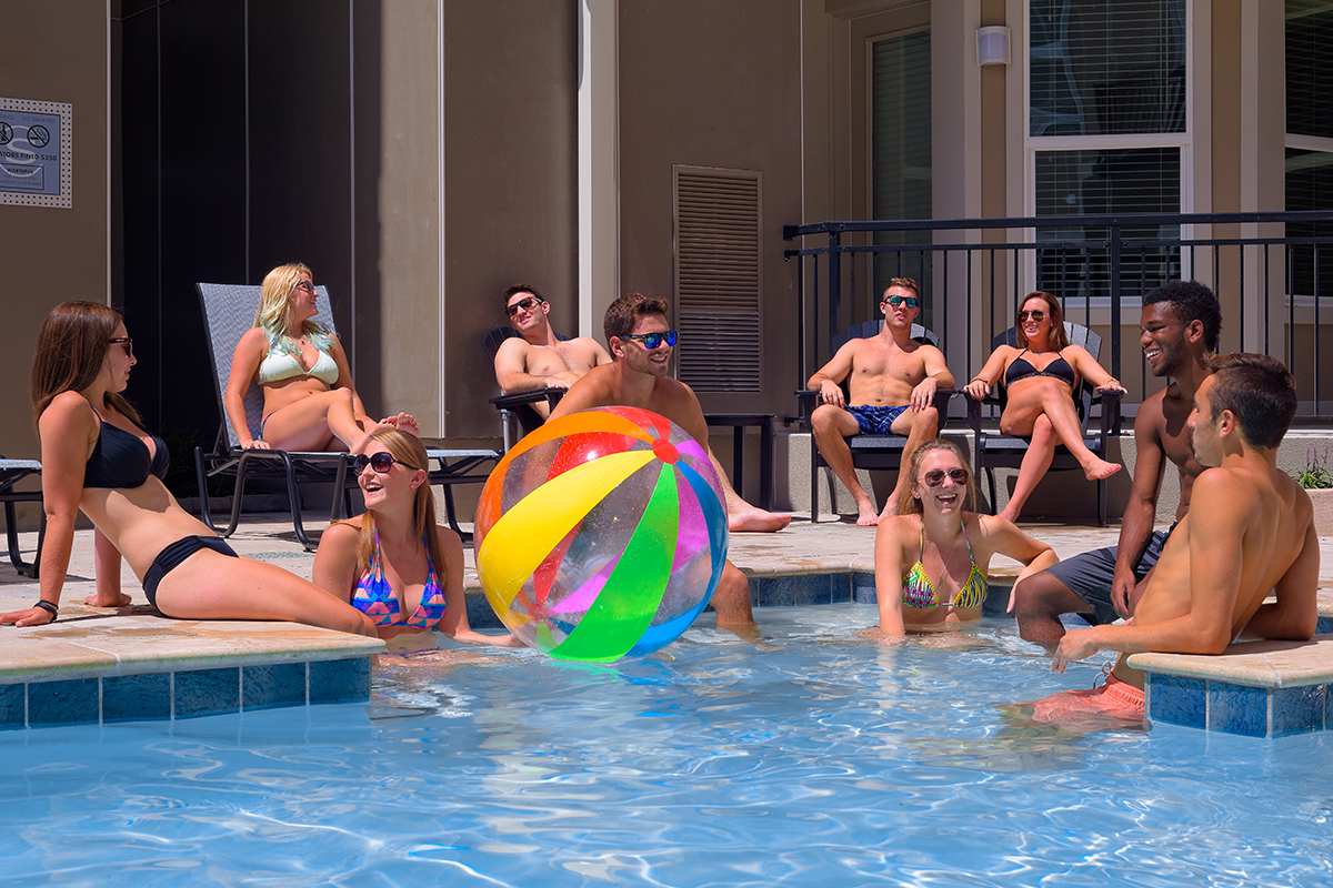 Young residents enjoying the resort style pool