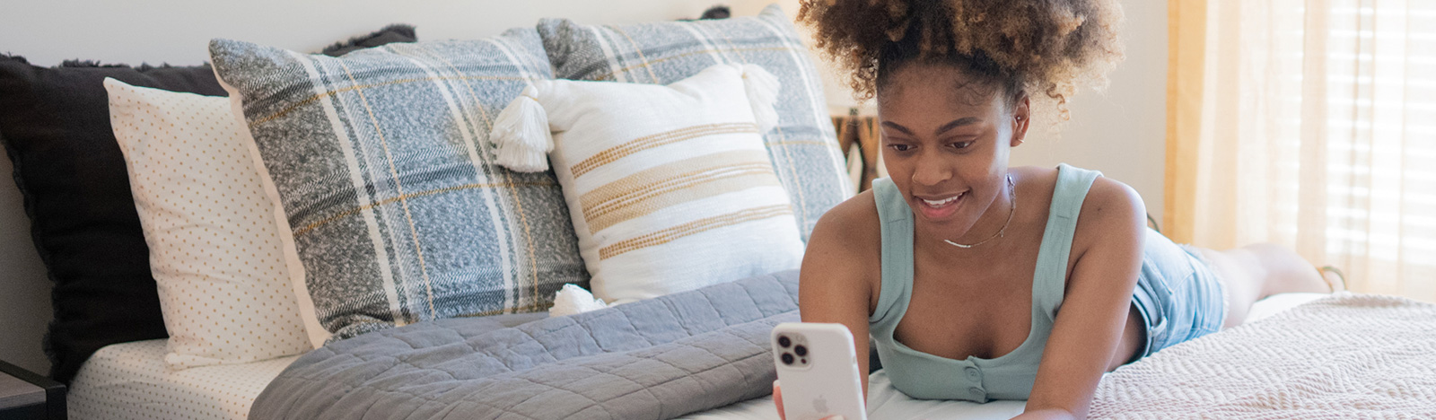resident on bed using phone