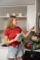 A woman in a kitchen with a snack