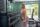 A woman doing arm exercises in a gym