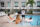 A group of people enjoying in a pool