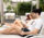 young adults lounging by the pool